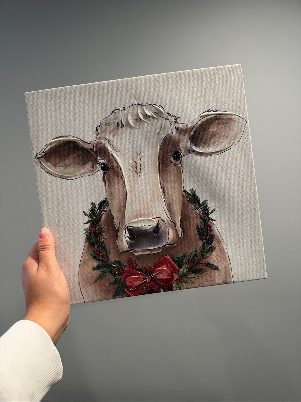 Festive Cow Canvas Art in Brown with Holiday Wreath